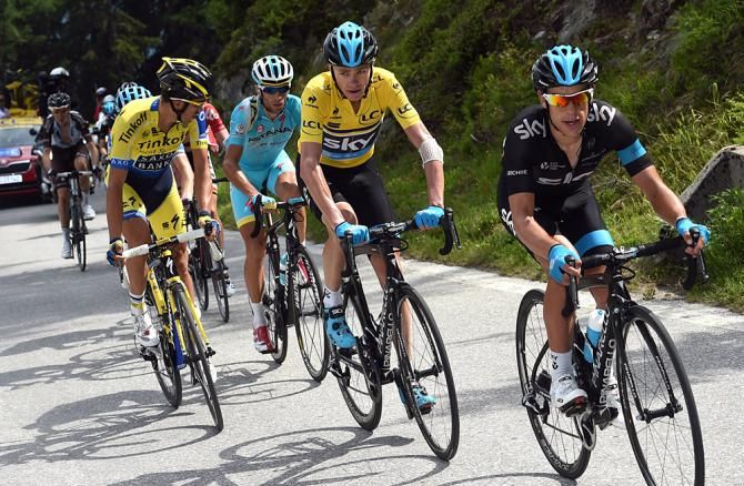 Richie Porte (Team Sky) helps teammate Chris Froome on the final climb
