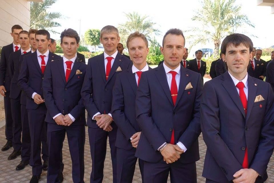 Riders pose for photos outside