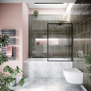 Modern small bathroom with shower over bath and reeded glass shower screen