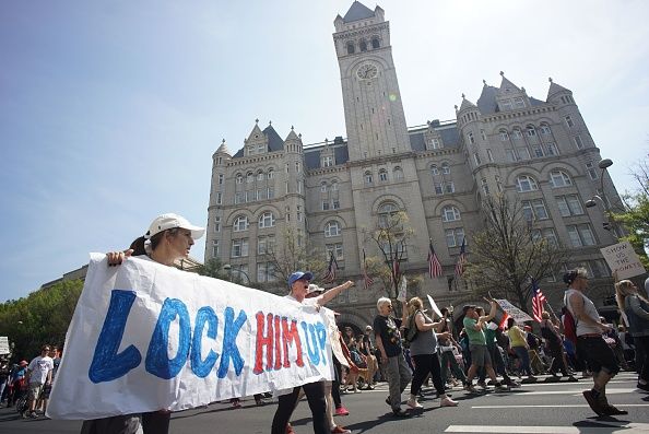 Protesters gather outside the D.C. hotel of President Trump.