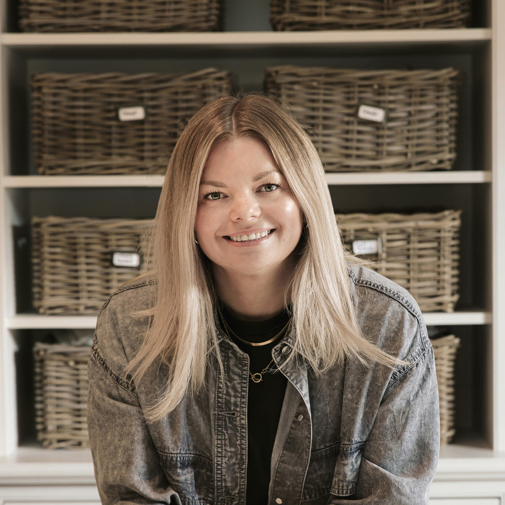 headshot of interior designer Claire Garner a woman with long blonde hair