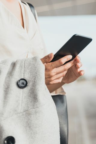 woman looking at an iPhone