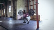 Woman doing a weighted squat