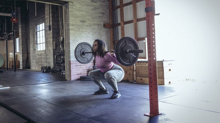 Woman doing a weighted squat