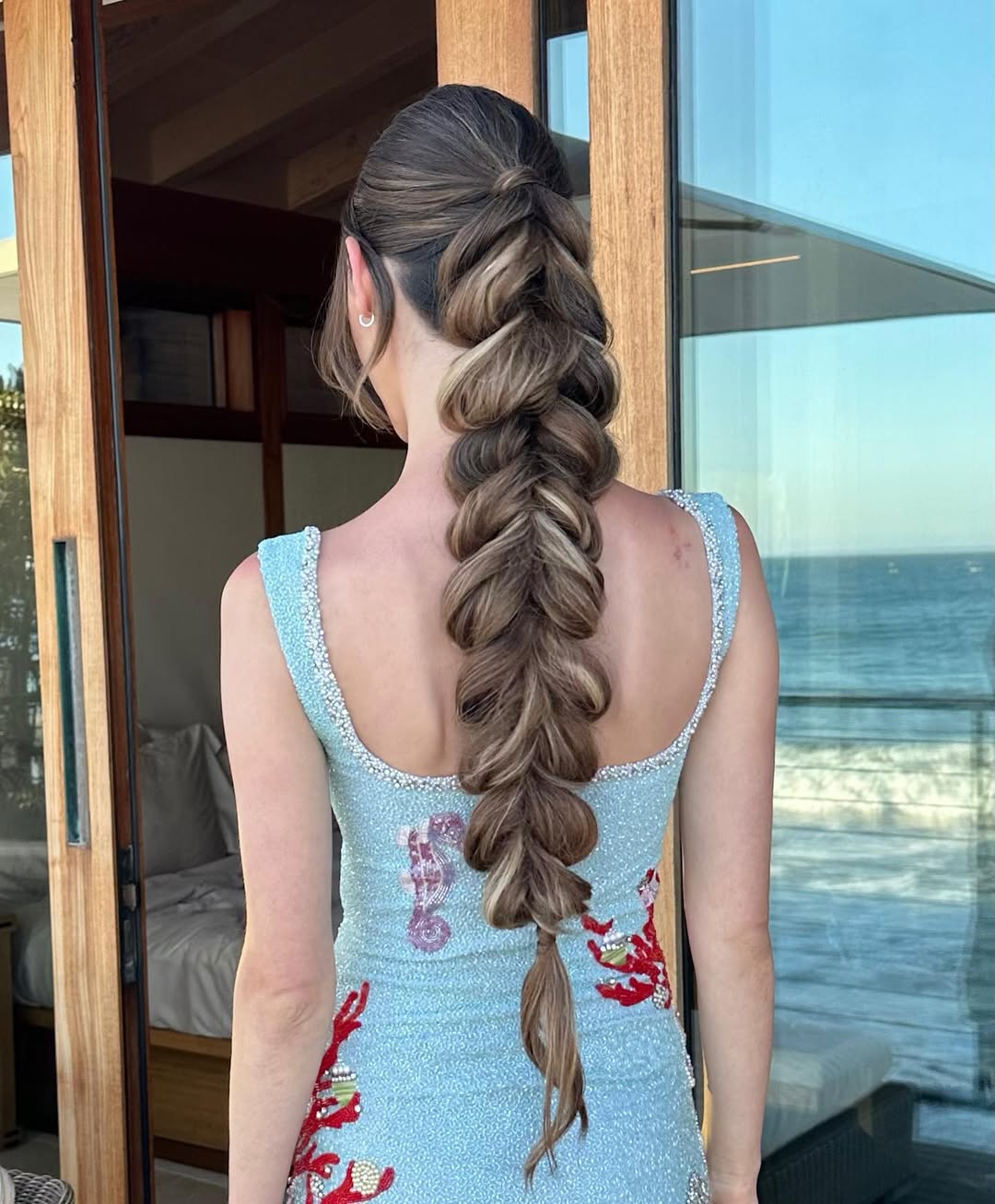 Ashley Mcilroy Dowad wears a pull-through fishtail braid by Justine Marjan