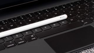 The Apple Pencil lying on the 12.9in Apple iPad Pro keyboard