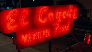 A close of a neon sign for El Coyote in Once Upon A Time In Hollywood