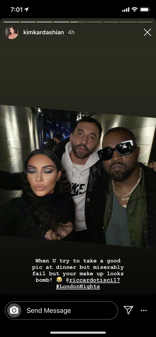 Kim Kardashian blinks while taking a selfie.