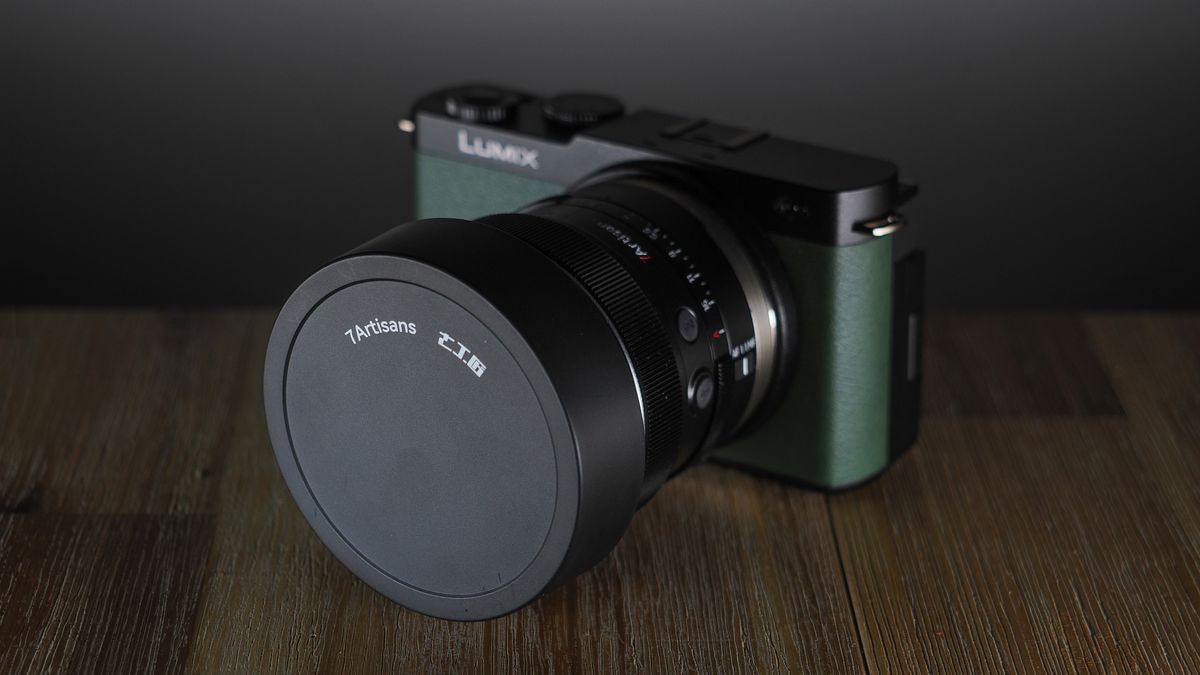 7Artisans AF 10mm f/2.5 Fisheye Max lens, mounted to a Panasonic Lumix S9, on a wooden surface