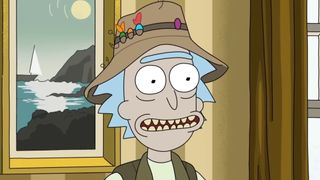 Rick wearing a fishing hat and smiling. 