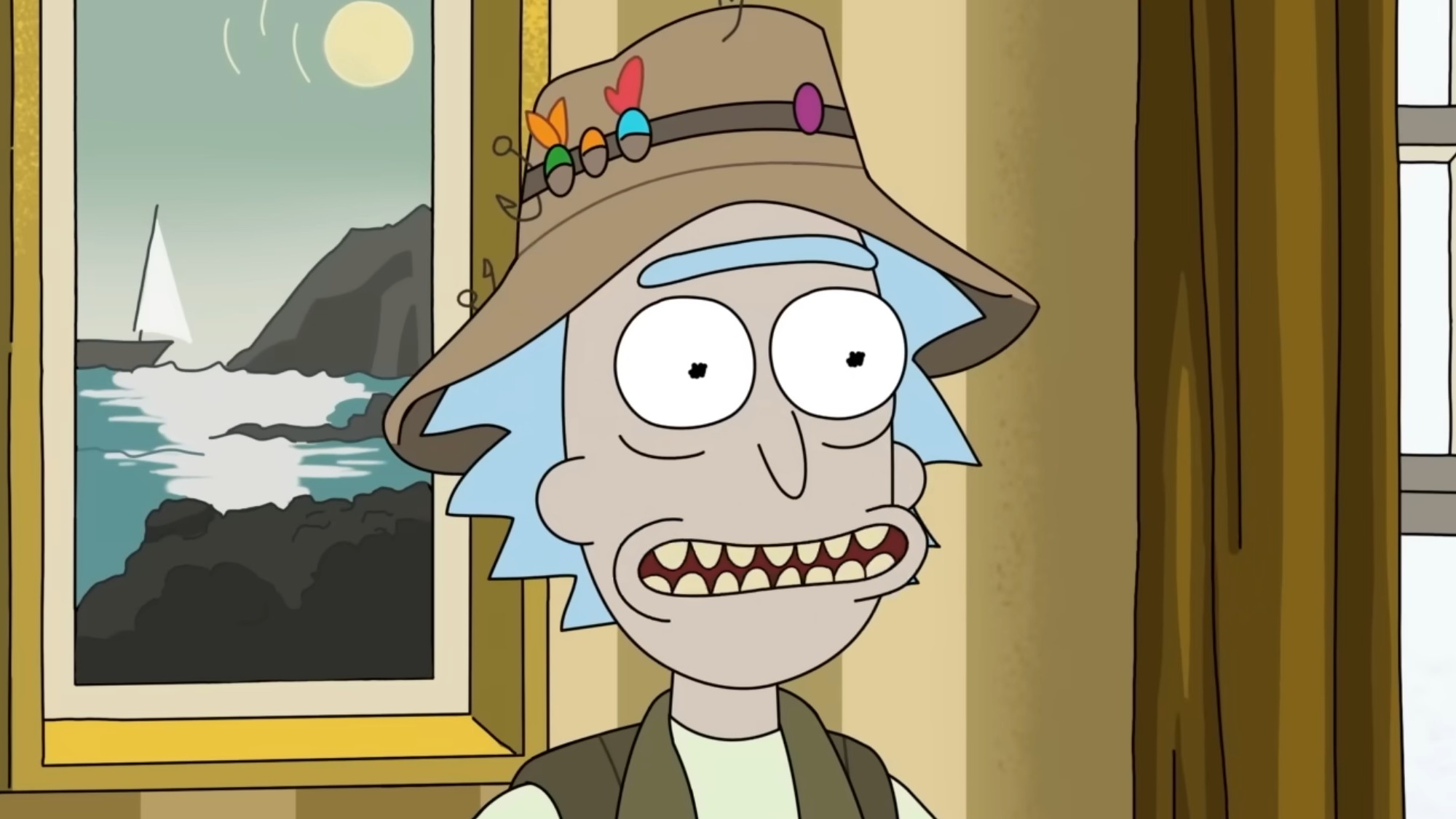 Rick wearing a fishing hat and smiling. 