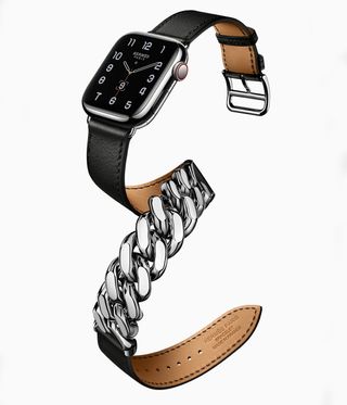 Black Apple Watch Hermès series 8 with leather and steel chain strap, against a white background