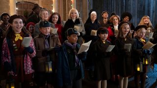 The cast singing carols in front of Nonnatus House in Call the Midwife Christmas special 2024