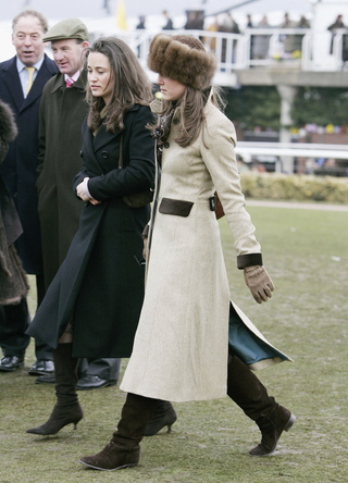 Pippa Middleton and Prince William's girlfriend Kate Middleton, wearing a Russian-style fur hat, attend the final day of Cheltenham Races on March 17, 2006 in Cheltenham, England
