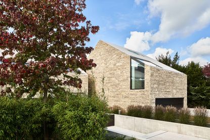 Stone Clad Villa by Titus Bernhard Architekten