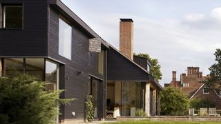 a large self build home with shou sugi ban charred timber cladding