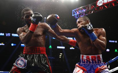 NEW YORK, NY - OCTOBER 14:Erislandy Lara punches Terrell Gausha during their WBA Junior Middleweight Title bout at Barclays Center of Brooklyn on October 14, 2017 in New York City.(Photo by A