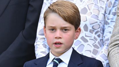 Why Prince George will require help on coronation day. Seen here at the Men's Singles Final