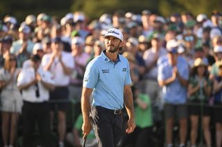 Max Homa waits on the 18th green