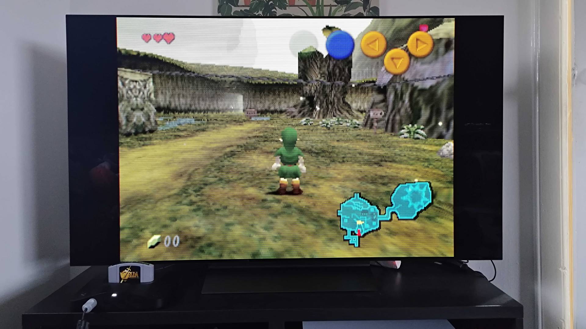 Analogue 3D connected to LG OLED C4 TV with Zelda: Ocarina of time gameplay on screen.