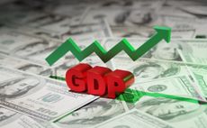 GDP sign and green upwards arrow sits on top of American dollars