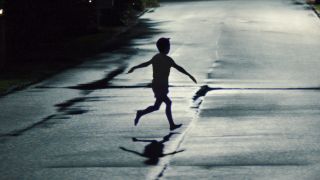 Weapons kids arms out silhouette on road