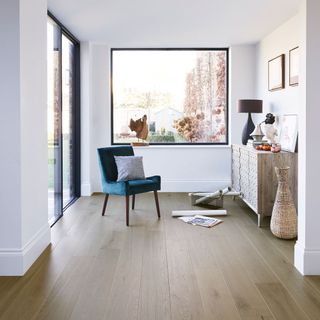 room with white wall and wooden floor