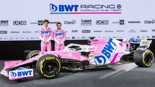 Racing Point drivers Lance Stroll and Sergio Perez stand next to the RP20 F1 2020 car