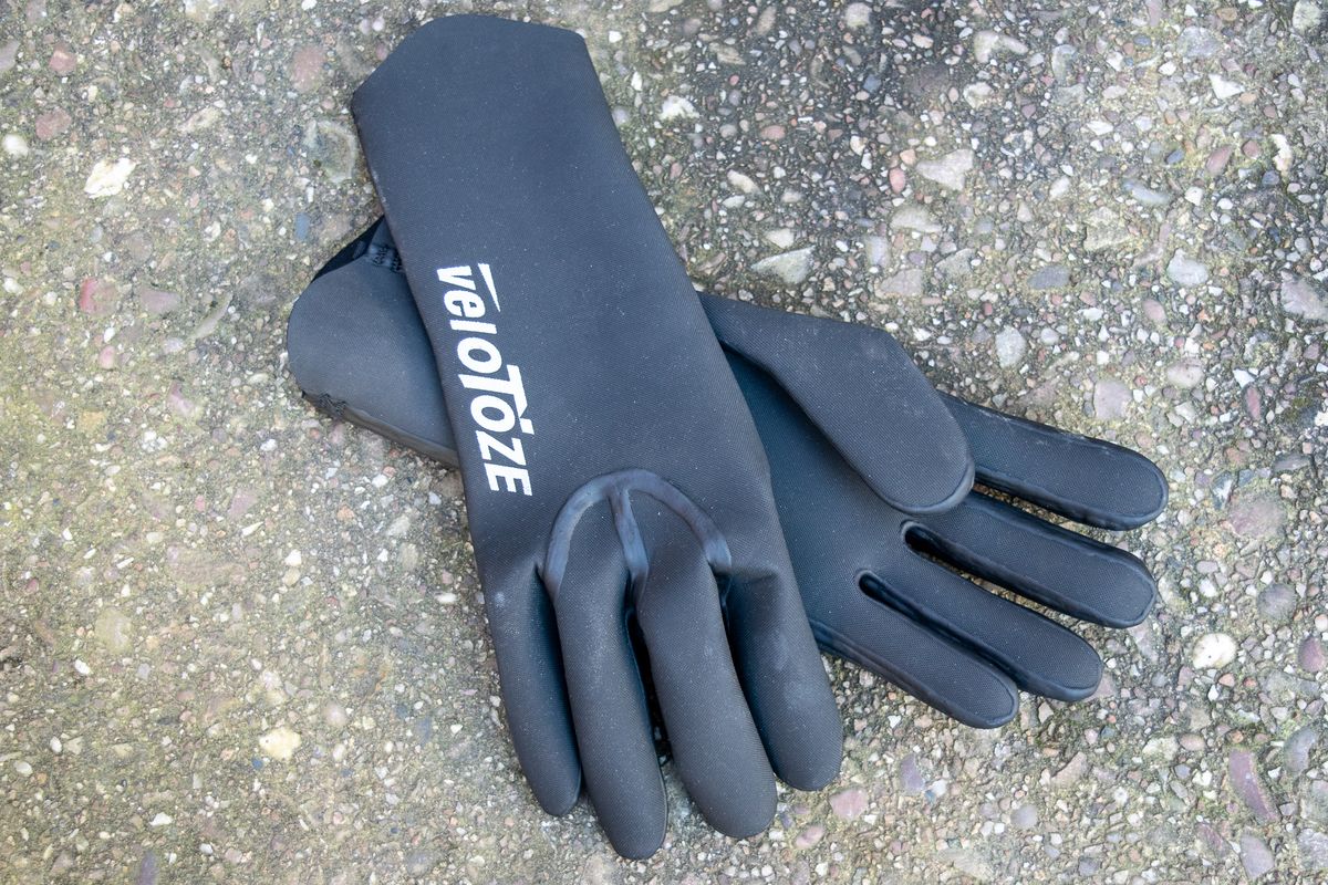 Black Velotoze neoprene gloves on some concrete