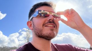 The author wearing solar eclipse glasses