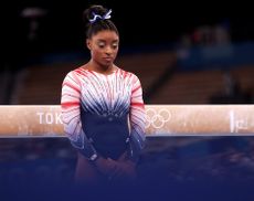 Simone Biles performs the beam at the Tokyo Olympics