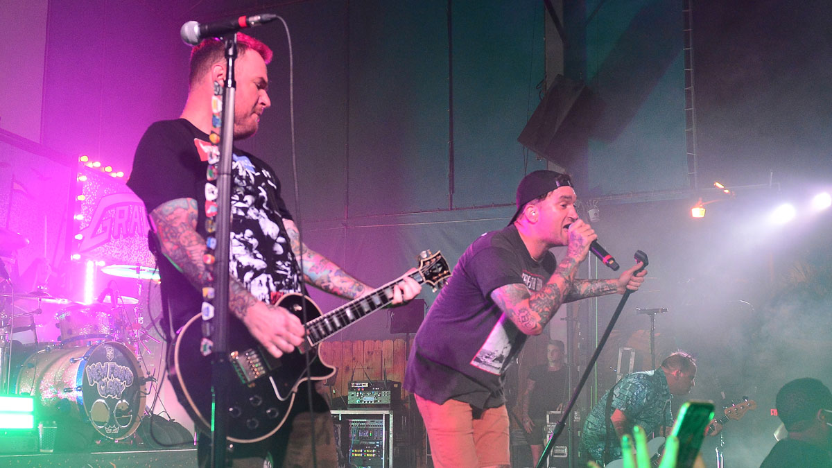 Chad Gilbert; Jordan Pundik and Ian Grushka of New Found Glory perform live on stage at Revolution Live Outdoors at the Backyard on October 15, 2021 in Fort Lauderdale, Florida.