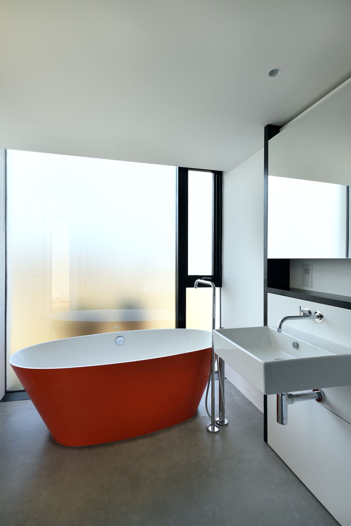 frosted glass in bathroom with red pink bath