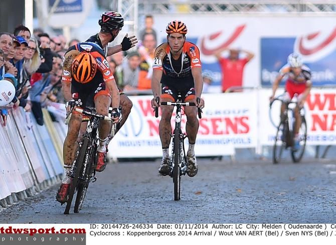 Sven Nys (Crelan-AA Drink Team) looks back at Van Aert's lapped teammate in frustration