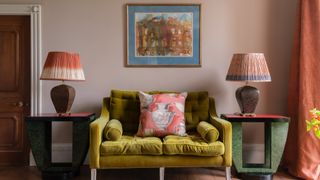 A living room with pink walls