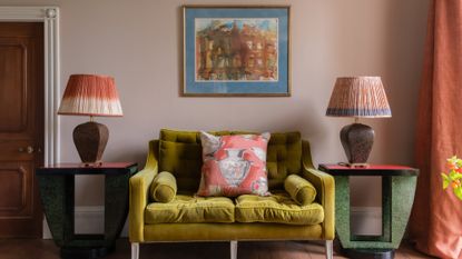 A living room with pink walls