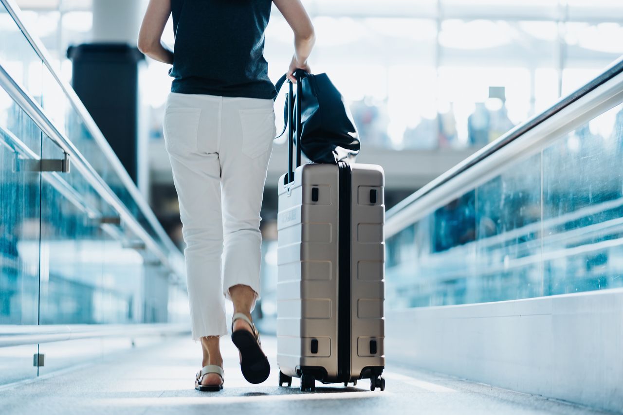 Woman walking in airport.