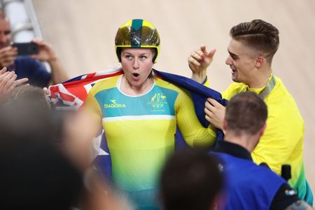 Stephanie Morton with Matt Glaetzer after she won gold in the Keirin