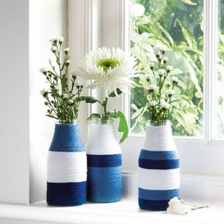 blue and white strip flower pot near window