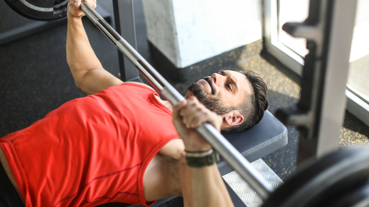 Man performing bench press