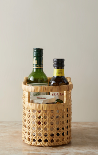 rattan storage basket holding kitchen dressings