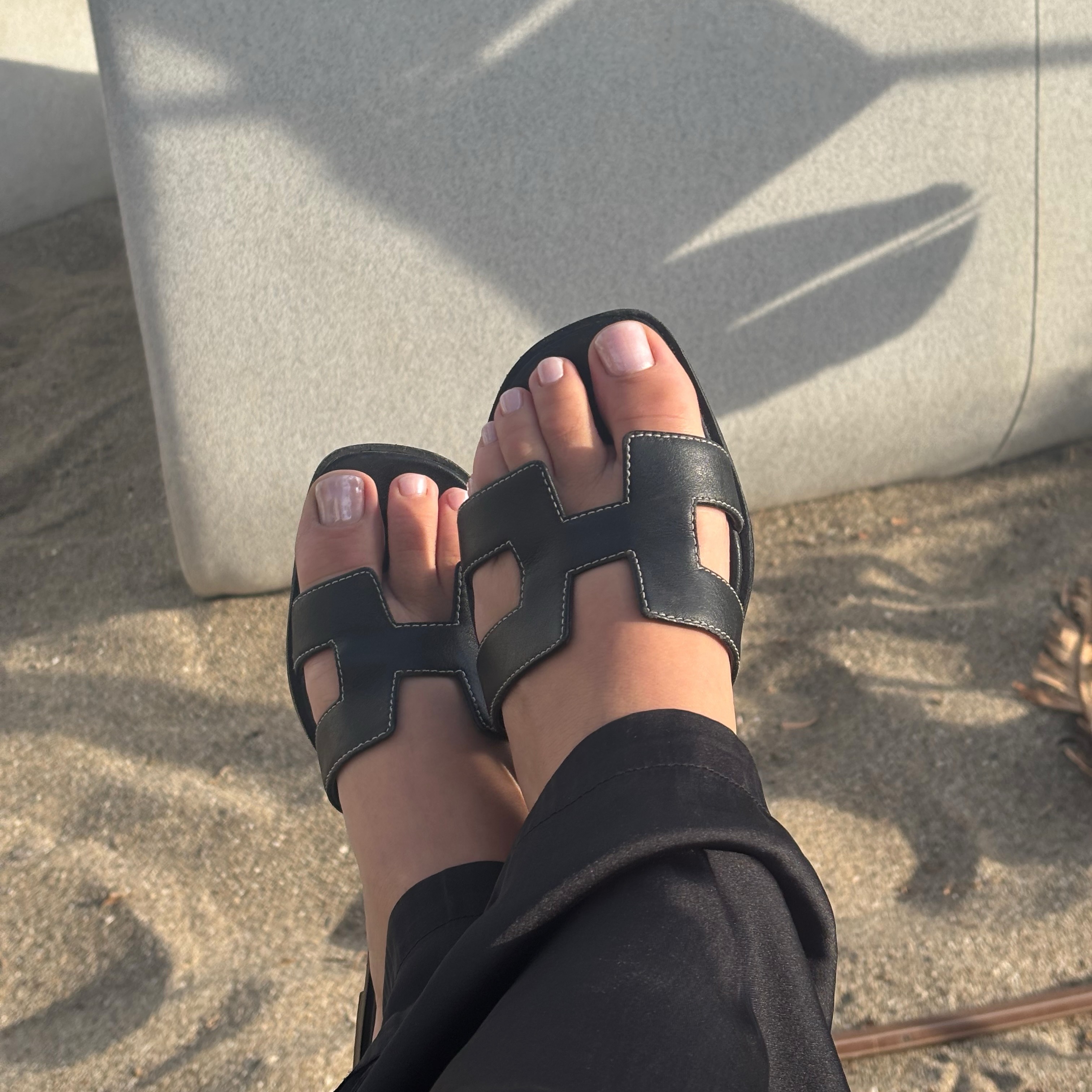 A sheer shimmer pink pedicure