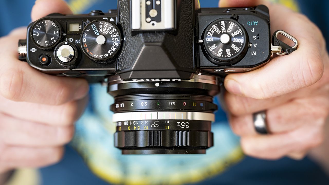 Voigtlander D 35mm f1.2 Nokton lens in the hand on a Nikon Z fc