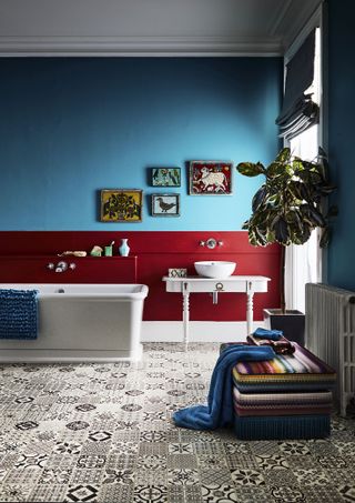 bathroom with patterned floor, freestanding bath and countertop basin