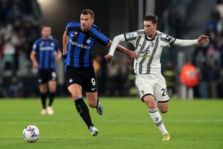 Edin Dzeko of FC Internazionale is challenged by Fabio Miretti of Juventus during the Serie A match between Juventus and FC Internazionale at on November 06, 2022 in Turin, Italy.