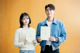 Actors IU and Park Bo-gum pose while holding scripts for 'When Life Gives You Tangerines'