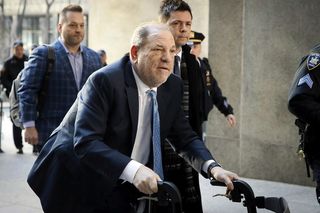 Harvey Weinstein using a walking aid