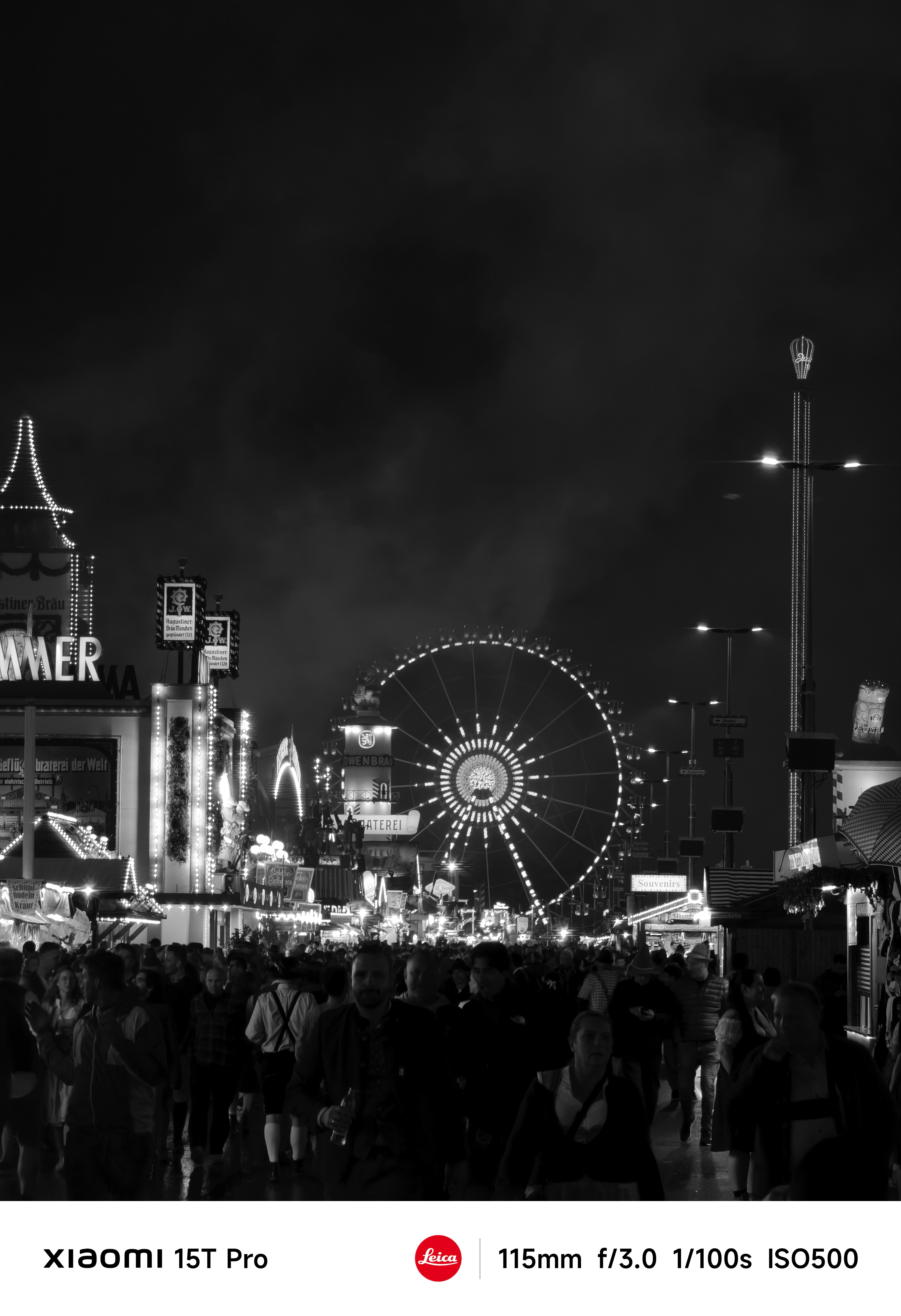 Fun fair at night with a Ferris wheel in the distance