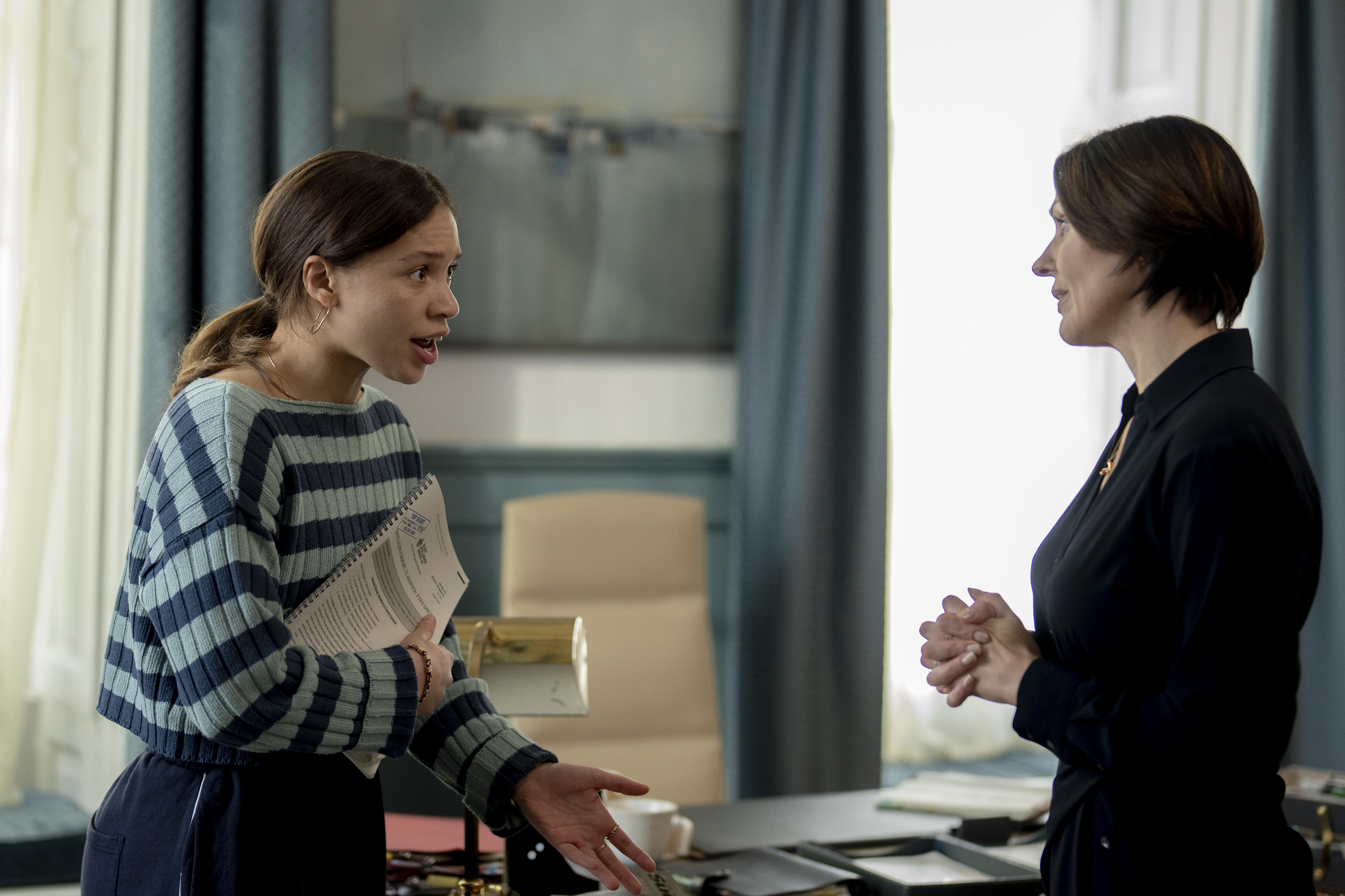 Isobel Akuwudike and Suranne Jones having a tense conversation in an office in the hostage