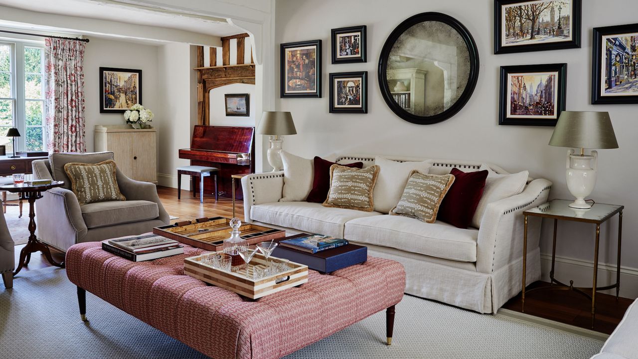 living room with cream sofa and upholstered coffee table